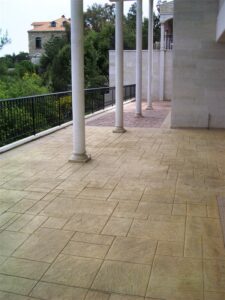 Elegant balcony with stone tiles and pillars