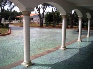 Arched walkway with tiled courtyard view