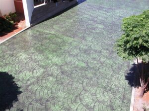 Textured concrete driveway in sunlight