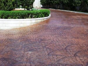 Stamped concrete driveway with garden