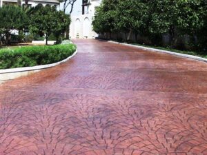 Red brick driveway with surrounding greenery