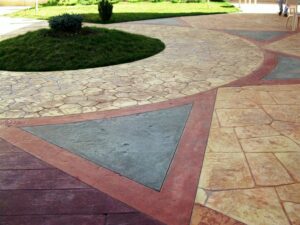 Textured stone walkway with grass centrepiece