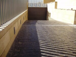 Modern garage with stone pavement