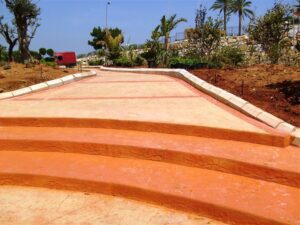 Vibrant orange walkway with surrounding plants