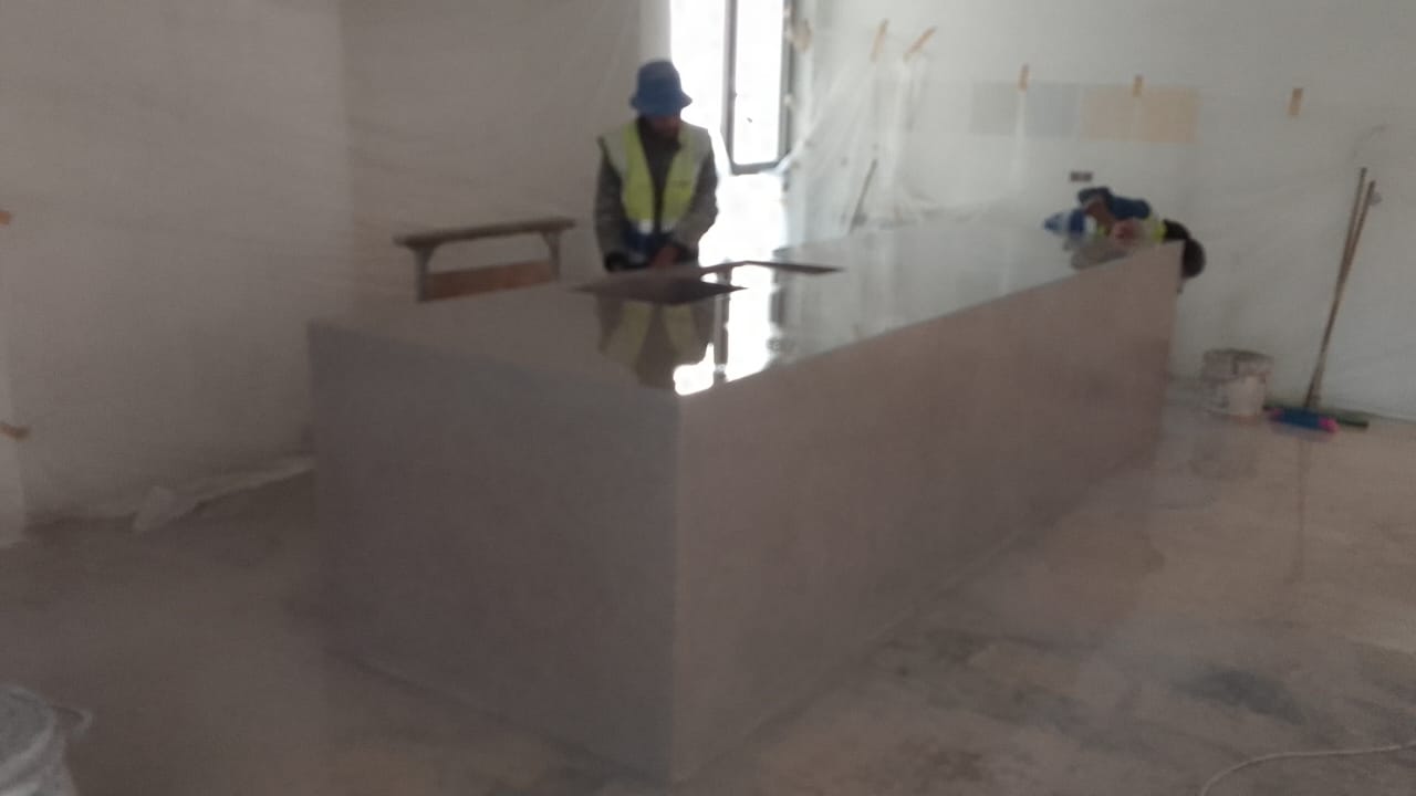 Worker in safety gear at construction site