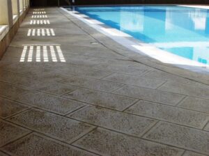 Empty pool area with blue water