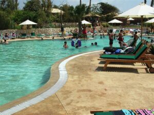 Families swimming at outdoor pool