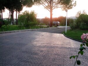 Sunset over a quiet cobblestone road