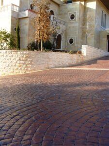 Stone house with circular driveway entrance