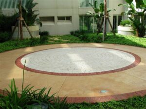 Round patio surrounded by greenery