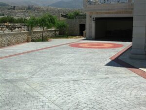 Stone driveway leading to open garage