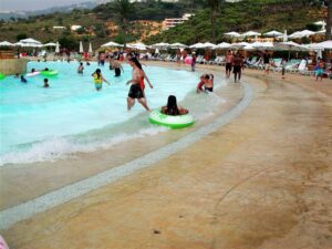 People enjoying a crowded water park