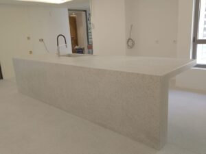 Modern white kitchen island with faucet