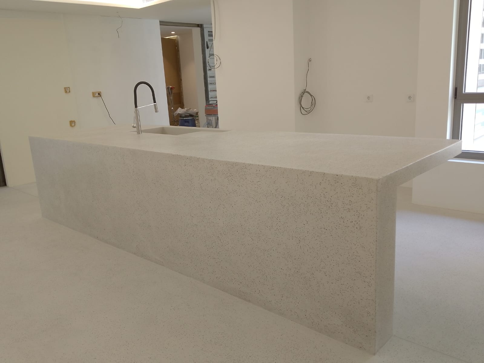 Modern white kitchen island with faucet