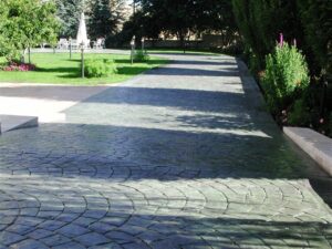 Curved stone pathway with greenery