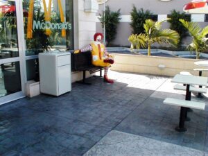 McDonald's mascot on a bench