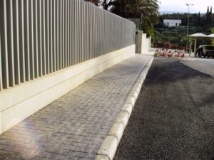 Paved pathway with metal fencing