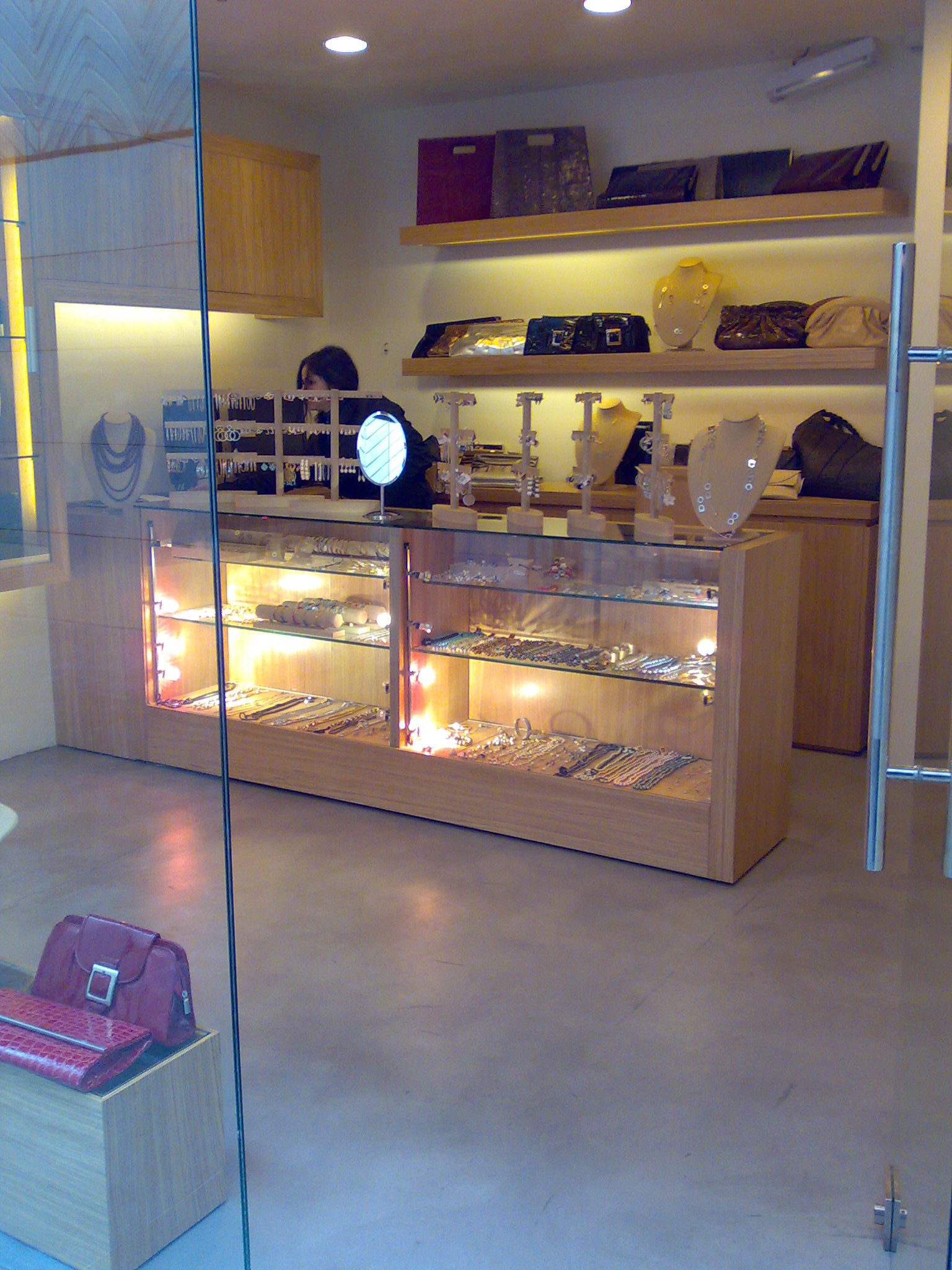 Jewelry store display with handbags
