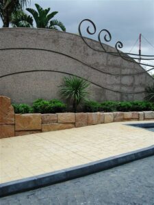 Stone wall with greenery and patterns