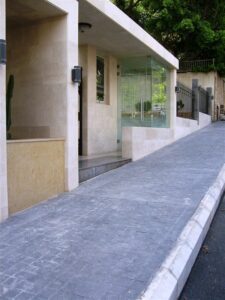 Urban pathway alongside sleek building facade