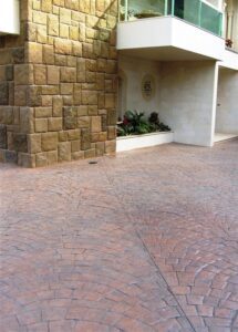 Stone wall and paved courtyard