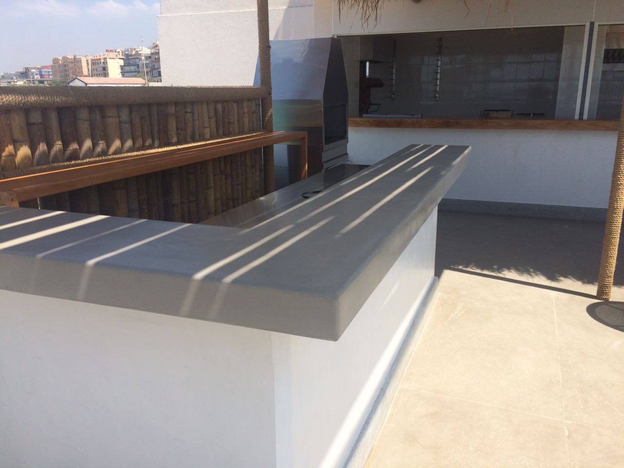 Sunny rooftop bar with shadows