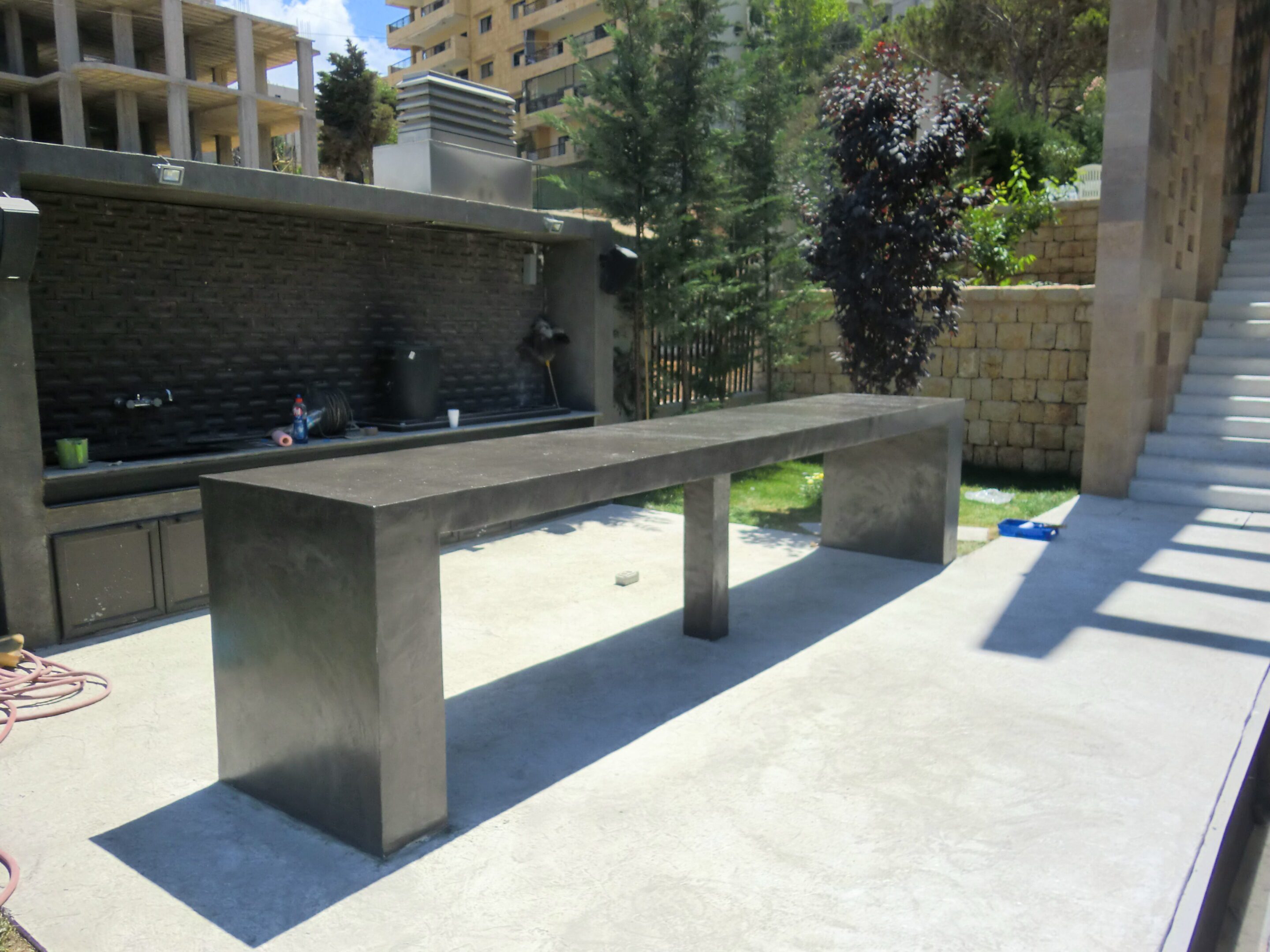 Sleek concrete table in garden setting