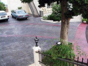 Cobblestone driveway with parked cars