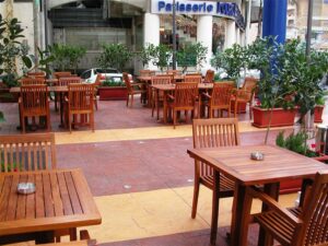 Empty café terrace with potted plants