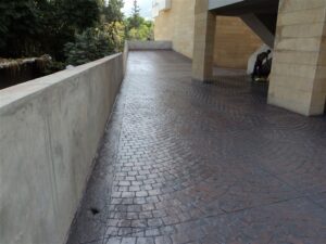 Curved pathway beside building