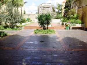 Urban courtyard with trees and benches