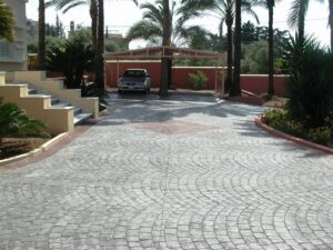 Cobblestone path leading to carport