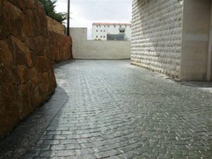 Stone-paved alley with brick walls