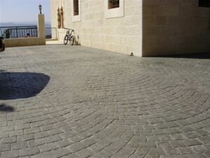 Stone courtyard with bicycle and railing view