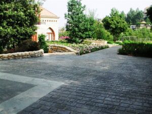 Quiet garden path near stone building