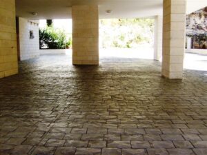 Sunlit stone walkway under a canopy