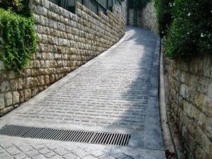 Steep cobblestone path with stone walls
