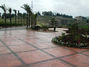 Landscaped garden beside tiled walkway