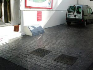 Empty parking space beside van