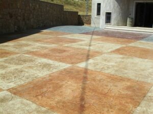 Patterned concrete driveway with stone texture