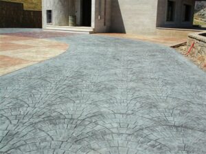 Patterned concrete driveway leading to house entrance