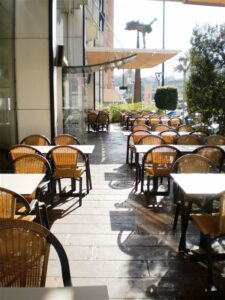 Sunlit outdoor dining area with chairs