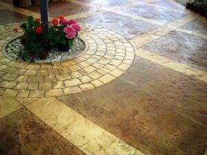 Decorative stone patio with vibrant flowers