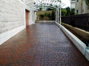 Brick pathway with metal canopy