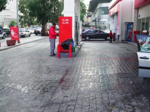 Man refueling at gas station