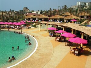 Resort pool with pink umbrellas