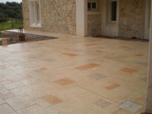 Spacious stone patio near garden area