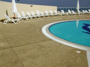 Empty poolside with lounge chairs