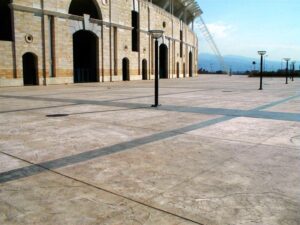 Empty courtyard with arched building facade