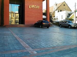 Modern building with parked cars